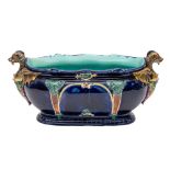 A Thomas Forester & Sons majolica blue-ground jardiniere and a small majolica duck tureen and cover