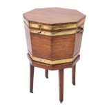 A George III mahogany and brass bound octagonal wine cooler on a stand,