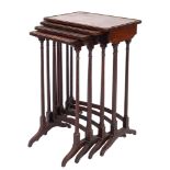 A set of early 19th Century rosewood and inlaid quartetto tables,