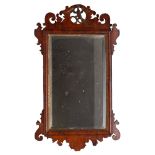 A walnut fret framed wall mirror in George I style,