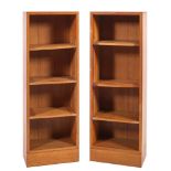 A pair of oak open bookcases, 20th century; possibly for Heals; of rectangular form,