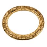 A carved and giltwood oval picture or mirror frame,