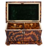 A George IV tortoiseshell tea caddy of sarcophagus form with two lidded compartments,