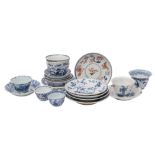 A collection of Chinese blue and white wine-cups/teabowls and saucers, Kangxi varied decoration,