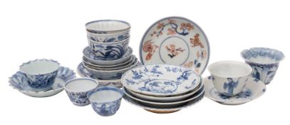 A collection of Chinese blue and white wine-cups/teabowls and saucers, Kangxi varied decoration,