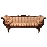 A 'Regency-Empire' carved mahogany and upholstered sofa,