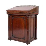 A Regency mahogany Davenport the sliding superstructure with a pierced brass ledge gallery,