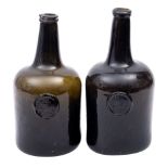 Two 18th century sealed cylinder wine bottles dated 1780 of dark olive colour with tapering neck