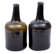 Two 18th century sealed cylinder wine bottles dated 1780 of dark olive colour with tapering neck