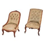 Two Victorian carved walnut and button upholstered nursing chairs,