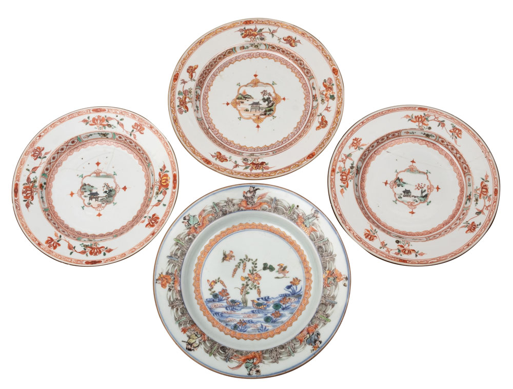 A group of three Chinese famille verte plates and one other the three painted to the centre with a