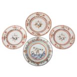 A group of three Chinese famille verte plates and one other the three painted to the centre with a
