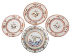 A group of three Chinese famille verte plates and one other the three painted to the centre with a