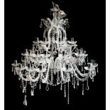 A contemporary cut glass three tier graduated twelve branch chandelier,