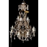 A metal and cut glass hung twelve light chandelier in Louis XV taste; 20th century;