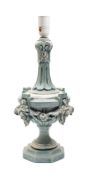 A carved wooden lamp of urn-shaped outline with slender fluted neck,