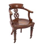 A Victorian oak desk chair,