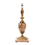 A polished alabaster and gilt metal mounted table lamp,