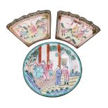 A Chinese Canton famille rose enamel dish and two similar segmented dishes the first decorated with