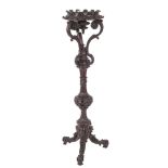 A Victorian carved and ebonised mahogany jardiniere stand, by John Black of London,