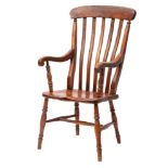 A Victorian elm, beech and oak lath back elbow chair,