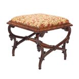 A Victorian carved rosewood square stool with an upholstered slip in seat in 17th Century crewel