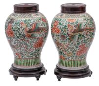 A pair of Chinese wucai 'Phoenix' jars of baluster form,