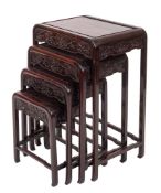 An early 20th century nest of Chinese hardwood tables, probably Zitan, of rounded rectangular form,