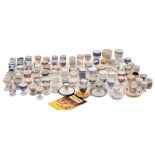 An extensive collection of ceramic egg cups, some 19th/ the majority 20th century,