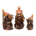 A graduated set of three Joseph Holdcroft majolica jugs each modelled as a seated brown bear,