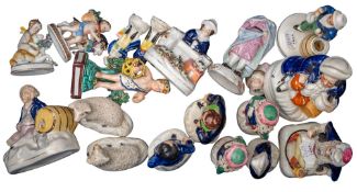 A group of 19th century Staffordshire pottery and porcelain figures including a pearlware bocage