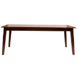 A stained hardwood, probably teak kitchen table, 20th century; with plain sides and ends,