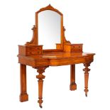 A late Victorian satinwood breakfront dressing table, the arched mirror,