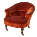 A Victorian brick red corduroy upholstered tub armchair,