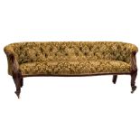 A Victorian carved walnut and upholstered sofa,