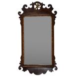 A parcel gilt walnut framed wall mirror in George I style,