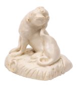 A rare Bow white figure of a pug-dog naturalistically modelled wearing a collar and seated on its