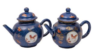 A pair of Chinese porcelain miniature teapots and covers,