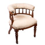 An early Victorian oak and partially upholstered library tub chair,