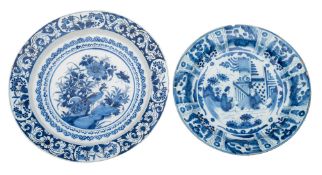 A Dutch blue and white delftware dish in Kraak style and one similar the first painted with Chinese