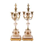 A pair of Continental alabaster and gilt metal mounted four light candelabra,