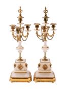 A pair of Continental alabaster and gilt metal mounted four light candelabra,
