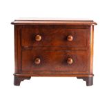 A Victorian miniature mahogany chest of two drawers,