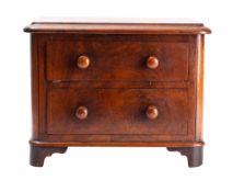 A Victorian miniature mahogany chest of two drawers,