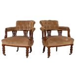 A pair of Edwardian walnut salon tub chairs,