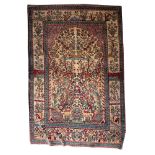 A Kirman prayer rug, the beige mihrab with a Tree of Life design of animals and flowering trees,