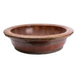 A substantial stained wood and metal banded bowl,