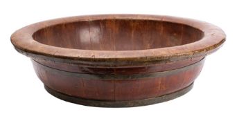 A substantial stained wood and metal banded bowl,