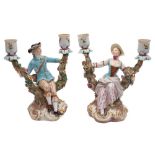 A pair of Meissen two-branch figural candleabra in the form of a gallant and companion seated