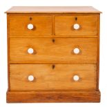 A Victorian Heals pine rectangular chest with a moulded top containing two short and two long